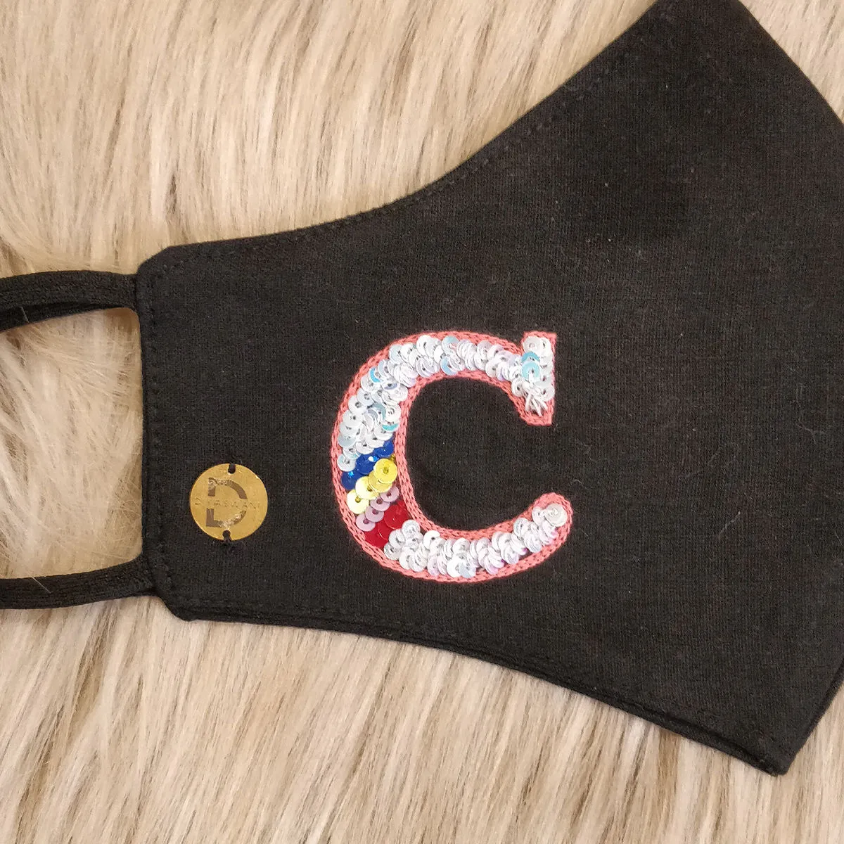 Diya Aswani Black Letter C With Rainbow Mask